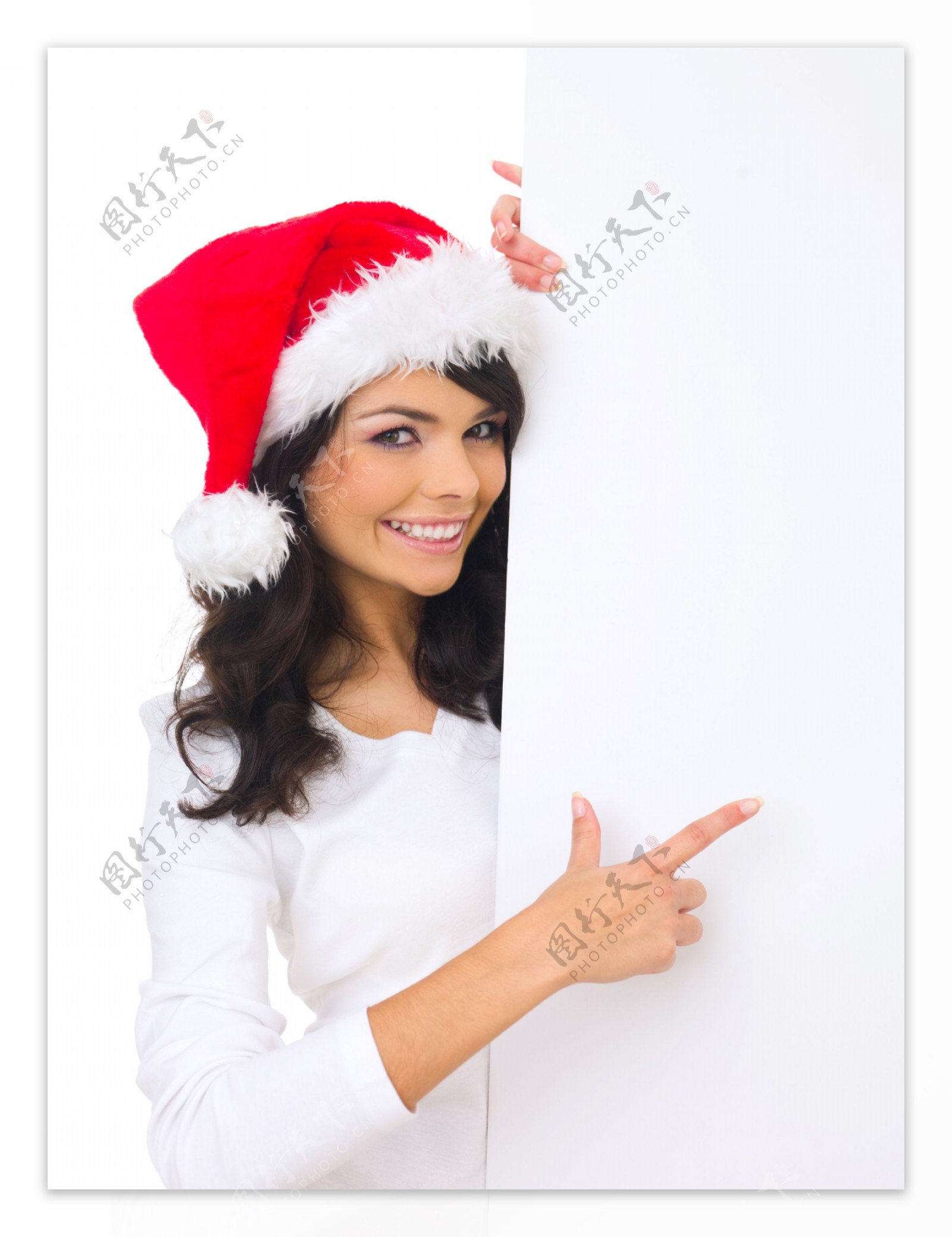 手指这空白广告牌的圣诞漂亮美女图片