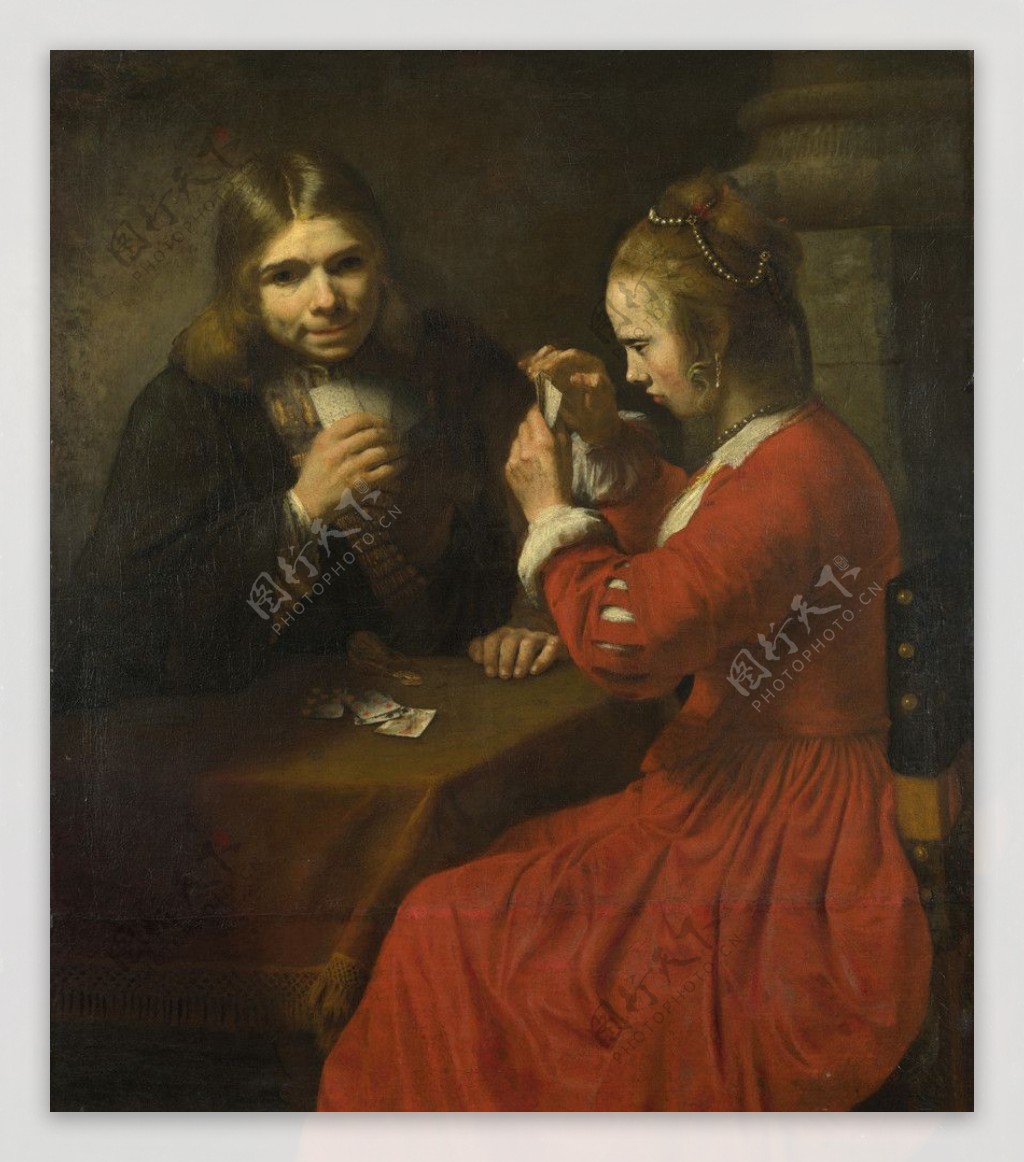 一位年轻的男人和一个姑娘玩扑克牌图片
