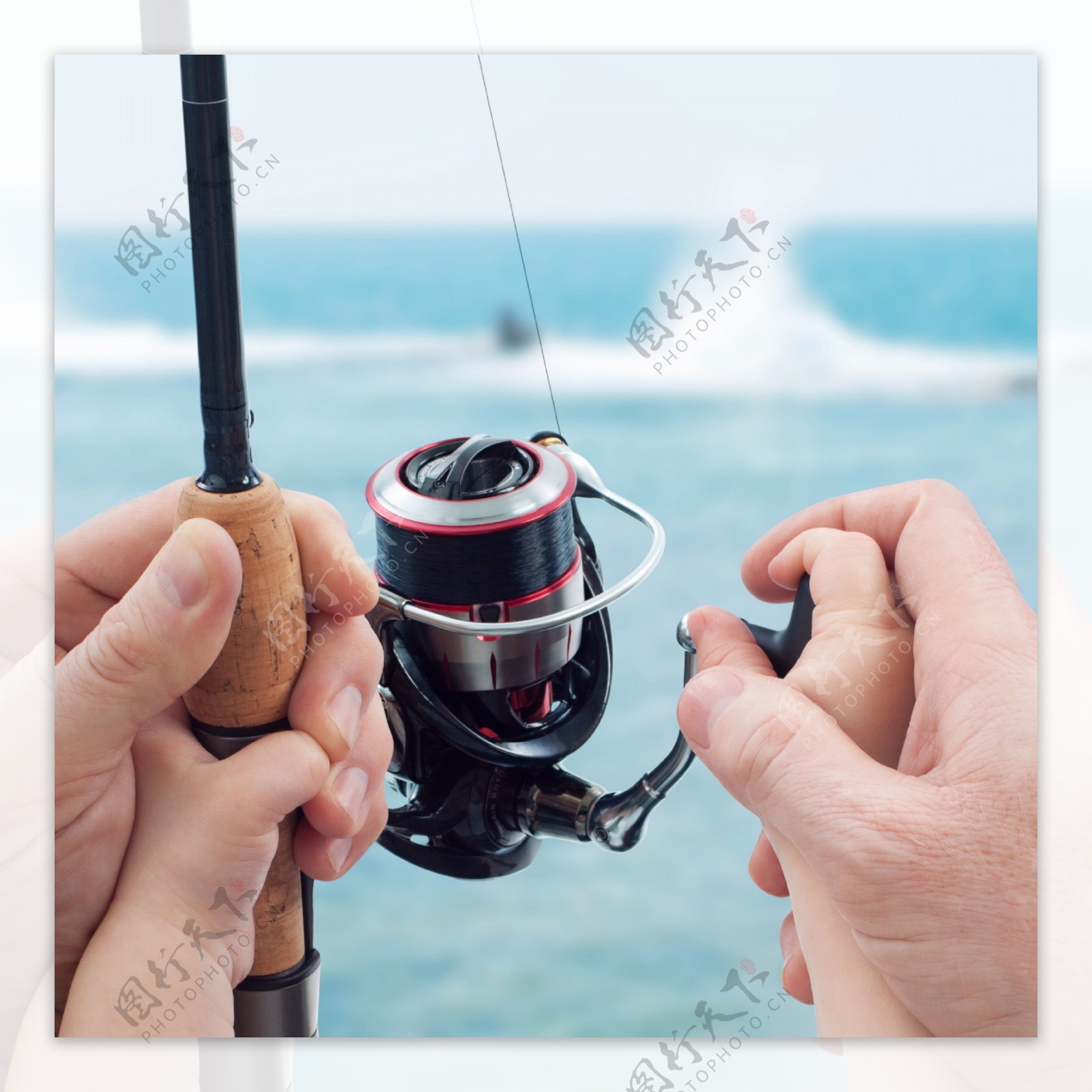 钓鱼鱼竿上的父子手图片